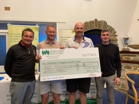 Cheque presentation at Oliver Brown's golf day